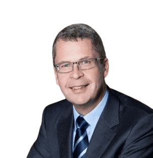 Smiling man in suit and tie with glasses