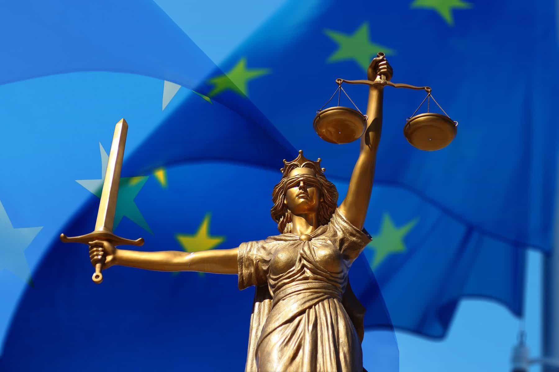 Lady Justice statue with EU flag background