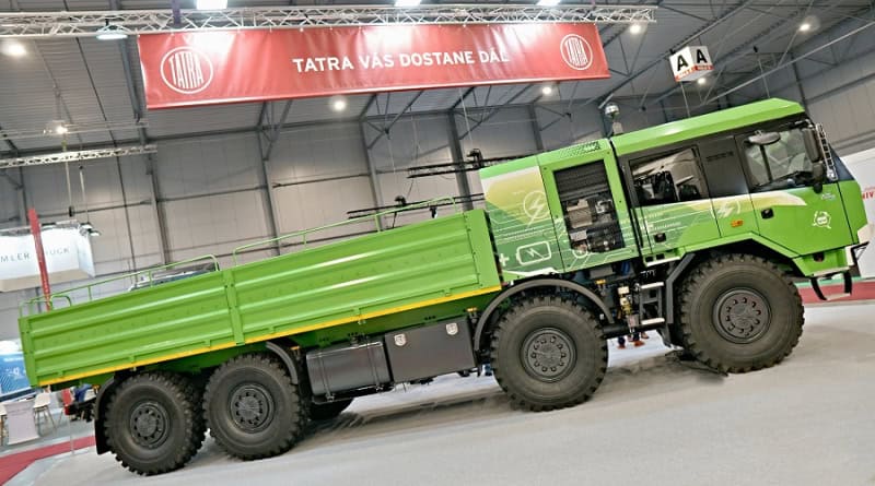 Green Tatra truck displayed at exhibition.