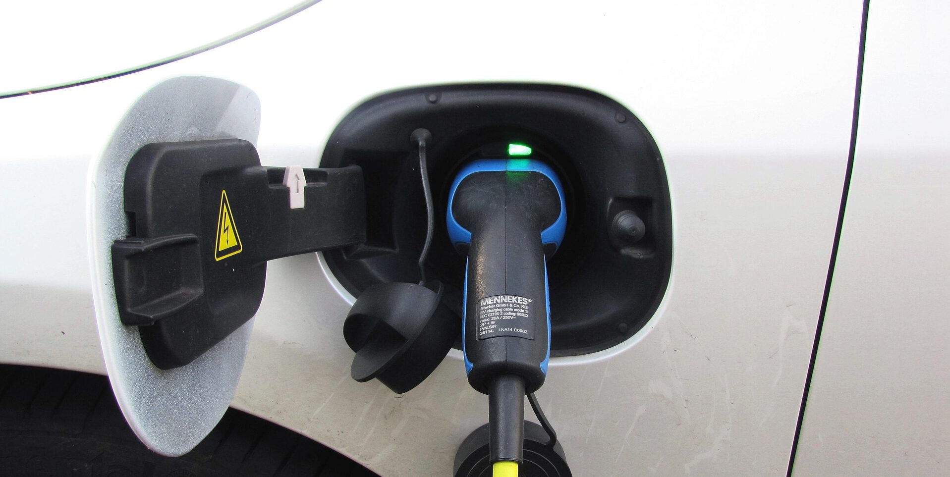 Electric car charging at station